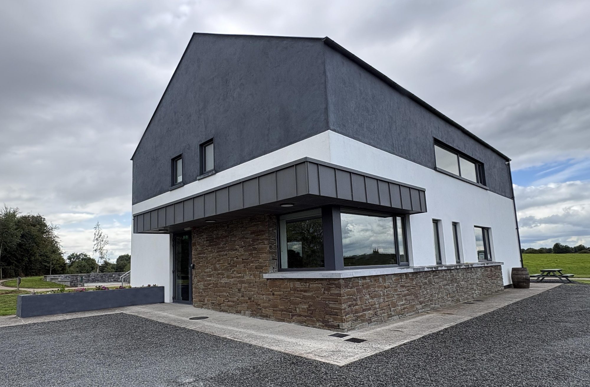 Carlanstown Kilbeg Community Centre, Deerpark, showing the entrance canopy and stone plinth